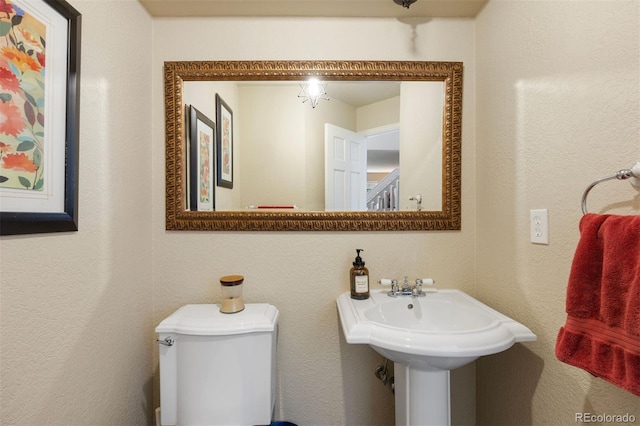 16268 E Belleview Dr, Centennial, CO 80015 - bathroom featuring toilet and a textured wall