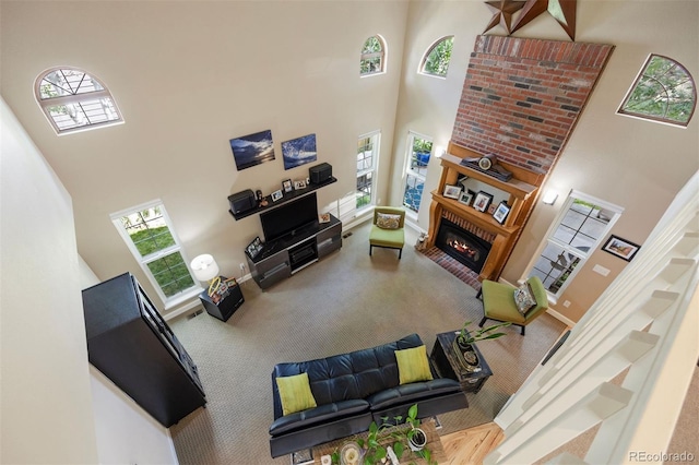 16268 E Belleview Dr, Centennial, CO 80015 - living room with a towering ceiling, carpet floors, and a brick fireplace