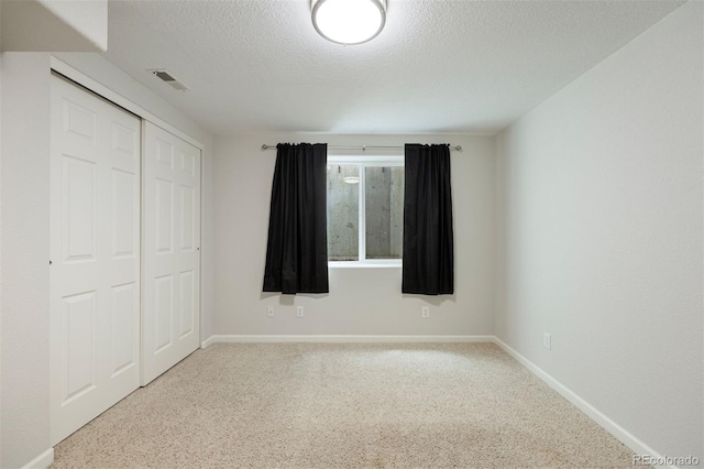 16268 E Belleview Dr, Centennial, CO 80015 - unfurnished bedroom featuring a textured ceiling, a closet, and carpet floors