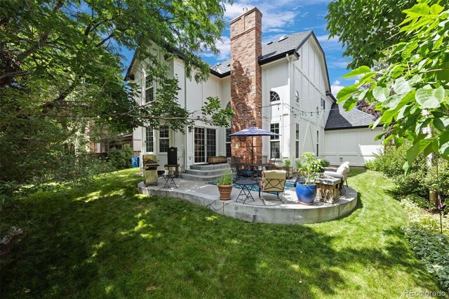 16268 E Belleview Dr, Centennial, CO 80015 - rear view of property with a patio area, a shingled roof, and a yard