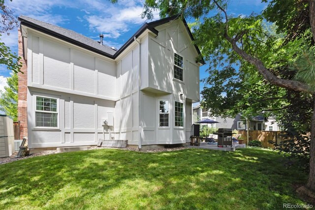16268 E Belleview Dr, Centennial, CO 80015 - rear view of house with a patio area