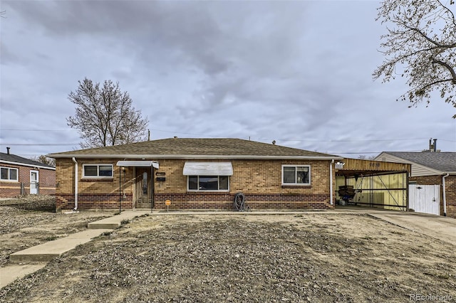 view of front of home featuring a carport