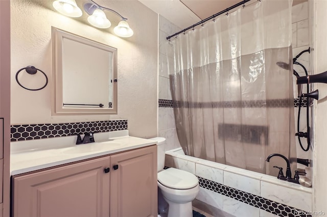 full bathroom with shower / bath combination with curtain, vanity, and toilet