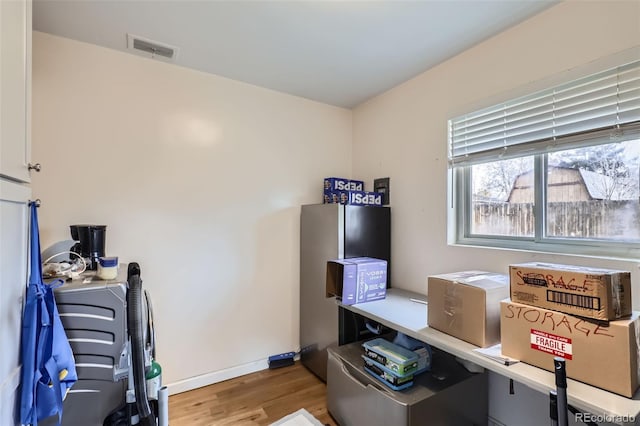 office area with hardwood / wood-style floors