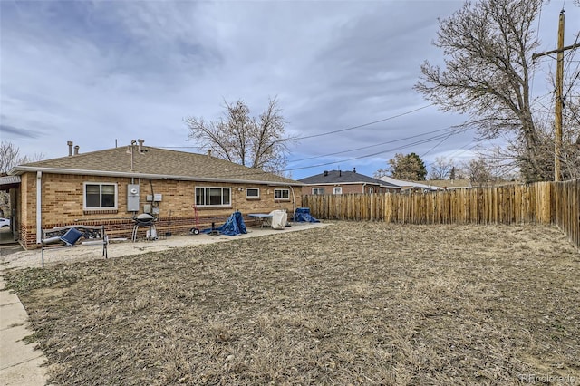 rear view of house with a patio