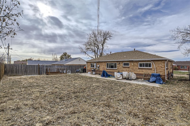 rear view of property featuring a patio