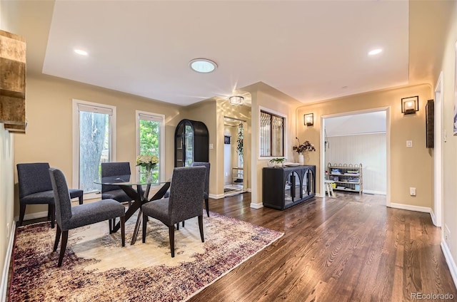 2684 S Adams St, Denver, CO 80210 - dining space with baseboards, dark wood-type flooring, recessed lighting, and arched walkways