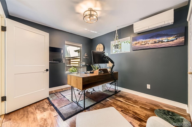 2684 S Adams St, Denver, CO 80210 - office with a wall mounted air conditioner, wood finished floors, and baseboards