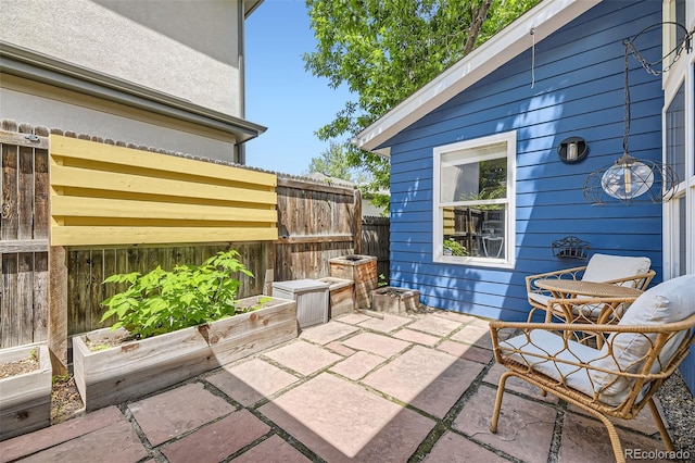 2684 S Adams St, Denver, CO 80210 - view of patio featuring a vegetable garden