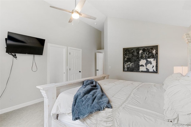 bedroom with ceiling fan, carpet, and high vaulted ceiling