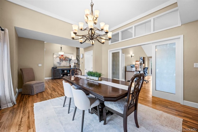 7717 S Grape Ct, Centennial, CO 80122 - dining area featuring a chandelier, light wood-type flooring, and baseboards