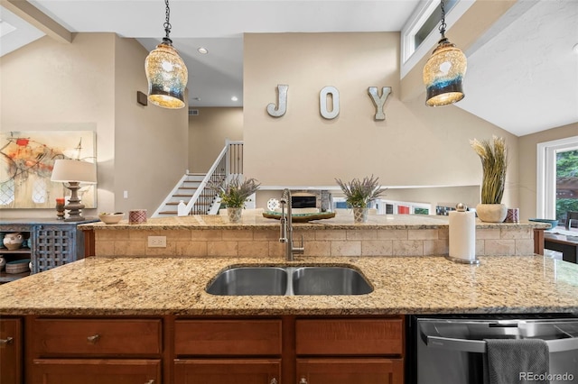 7717 S Grape Ct, Centennial, CO 80122 - kitchen featuring a sink, lofted ceiling, pendant lighting, light stone counters, and recessed lighting