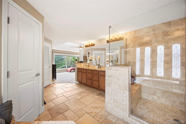 7717 S Grape Ct, Centennial, CO 80122 - full bath with vanity, stone tile flooring, and a bath