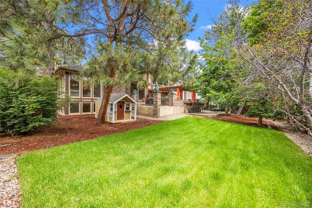 7717 S Grape Ct, Centennial, CO 80122 - view of green lawn with a patio area
