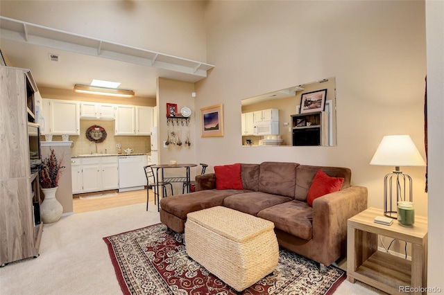 living room with light colored carpet