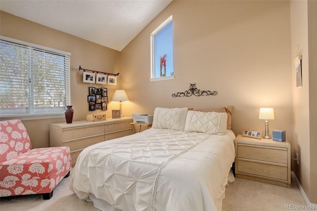 bedroom featuring light colored carpet, baseboards, and vaulted ceiling