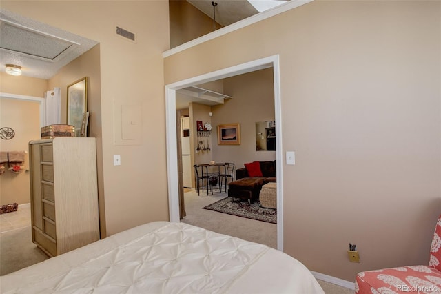 bedroom featuring visible vents, baseboards, and carpet
