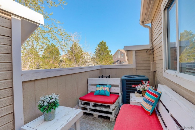 view of patio / terrace with central AC and a balcony