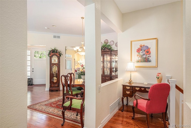 16929 W 63rd Ln, Golden, CO 80403 - office area featuring wood finished floors, a chandelier, and crown molding
