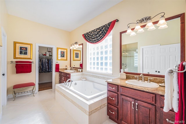16929 W 63rd Ln, Golden, CO 80403 - full bath with a shower stall, a tub with jets, vanity, tile patterned floors, and a walk in closet