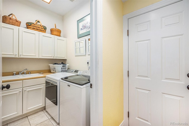 16929 W 63rd Ln, Golden, CO 80403 - laundry room featuring washing machine and clothes dryer, cabinet space, and light tile patterned flooring