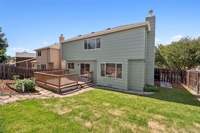 20396 E Berry Pl, Centennial, CO 80015 - rear view of house featuring a fenced backyard, a wooden deck, and a chimney