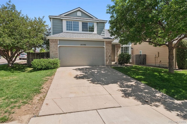 20396 E Berry Pl, Centennial, CO 80015 - view of front facade with brick siding, concrete driveway, an attached garage, and roof with shingles