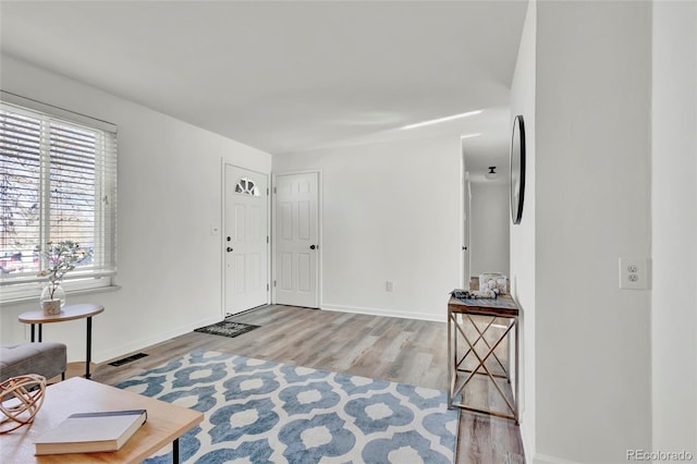 foyer with light wood-type flooring