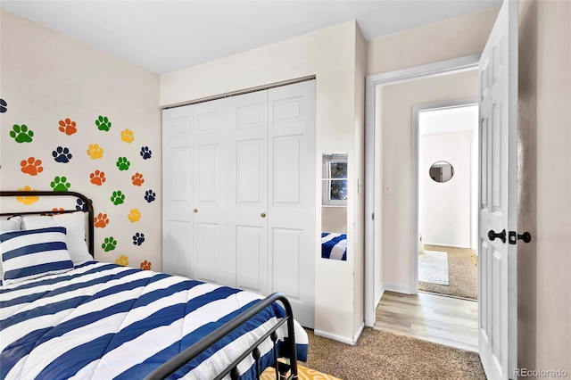 bedroom with a closet and carpet