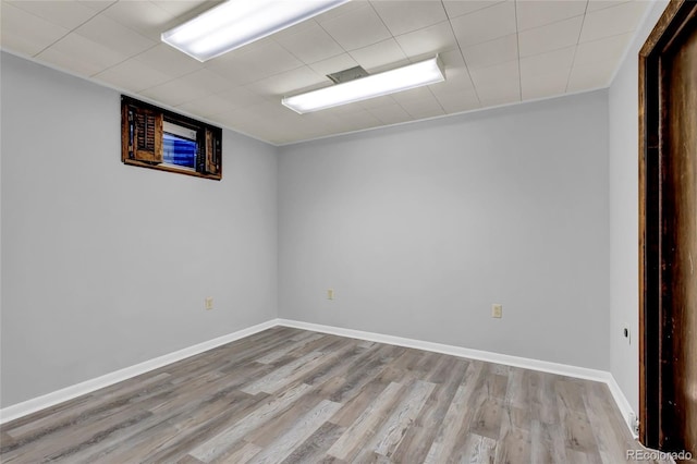 unfurnished room with light hardwood / wood-style floors