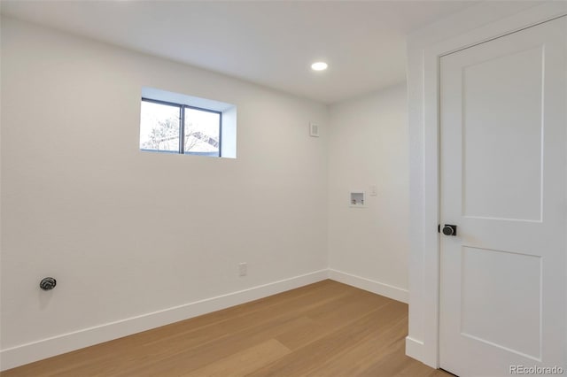 spare room with recessed lighting, light wood-type flooring, and baseboards