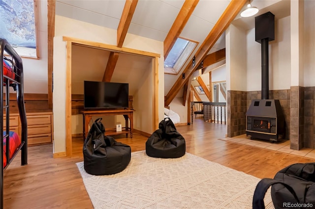 3237 Mill Creek Rd, Dumont, CO 80436 - living room featuring a skylight, wood finished floors, and a wood stove