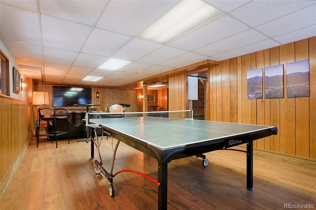 3237 Mill Creek Rd, Dumont, CO 80436 - game room with wooden walls, light wood-style floors, and a drop ceiling