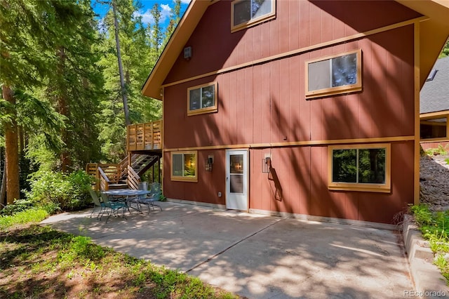 3237 Mill Creek Rd, Dumont, CO 80436 - back of property featuring stairway, a patio, and a deck
