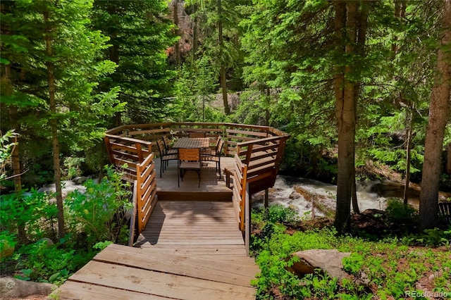 3237 Mill Creek Rd, Dumont, CO 80436 - view of community with outdoor dining area, a wooden deck, and a forest view