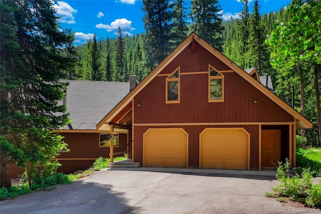 3237 Mill Creek Rd, Dumont, CO 80436 - view of front of home featuring a chimney and a forest view