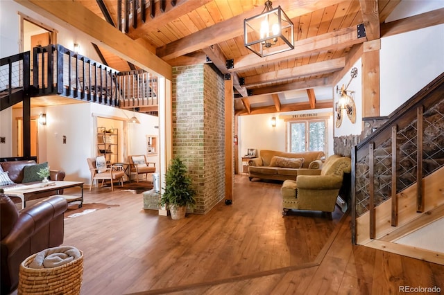 3237 Mill Creek Rd, Dumont, CO 80436 - living area featuring hardwood / wood-style floors, a wooden ceiling with exposed beams, and a chandelier
