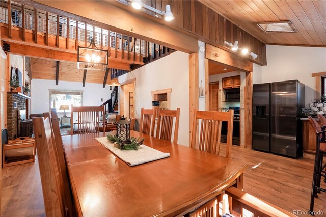 3237 Mill Creek Rd, Dumont, CO 80436 - dining space with wooden ceiling, vaulted ceiling, wood finished floors, and a chandelier