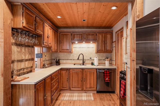3237 Mill Creek Rd, Dumont, CO 80436 - kitchen featuring stainless steel dishwasher, fridge with ice dispenser, recessed lighting, light countertops, and brown cabinetry