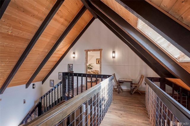 3237 Mill Creek Rd, Dumont, CO 80436 - corridor with wooden ceiling, a skylight, hardwood / wood-style flooring, and an upstairs landing