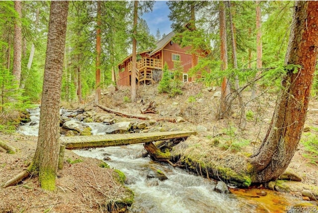 3237 Mill Creek Rd, Dumont, CO 80436 - view of yard with a forest view and stairway