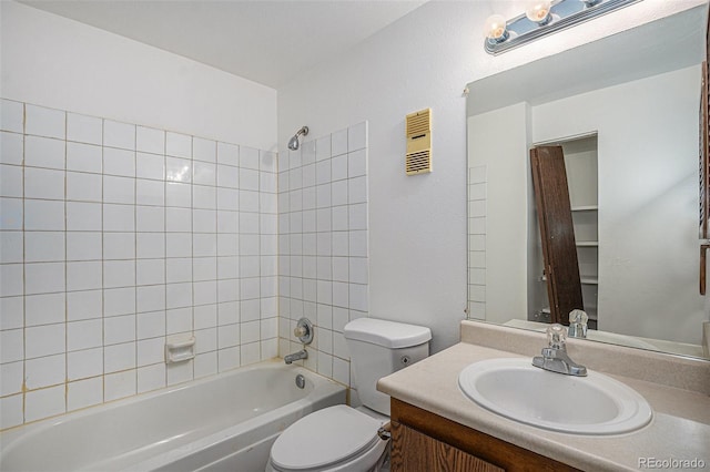 bathroom with toilet, shower / bath combination, and vanity