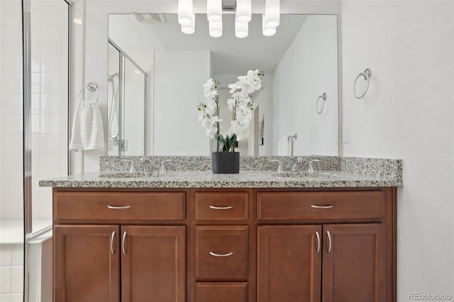 1743 Spring Water Pt, Colorado Springs, CO 80908 - full bathroom featuring double vanity and a shower stall