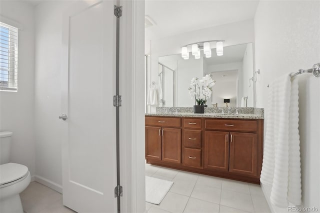 1743 Spring Water Pt, Colorado Springs, CO 80908 - full bathroom with toilet, double vanity, tile patterned flooring, and a stall shower