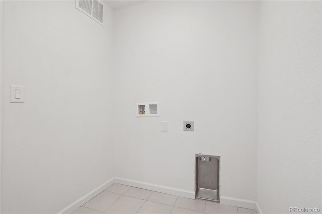 1743 Spring Water Pt, Colorado Springs, CO 80908 - laundry room with hookup for an electric dryer, washer hookup, baseboards, and light tile patterned floors