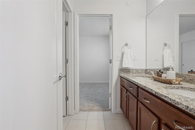 1743 Spring Water Pt, Colorado Springs, CO 80908 - full bath featuring double vanity, tile patterned flooring, and baseboards