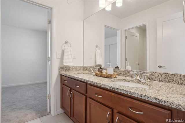 1743 Spring Water Pt, Colorado Springs, CO 80908 - full bathroom featuring double vanity, baseboards, and tile patterned floors