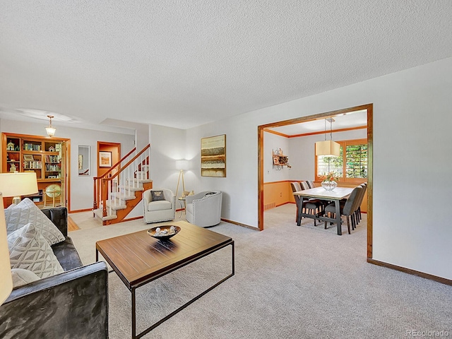 7335 S Milwaukee Way, Centennial, CO 80122 - living room featuring stairs, a textured ceiling, and light carpet