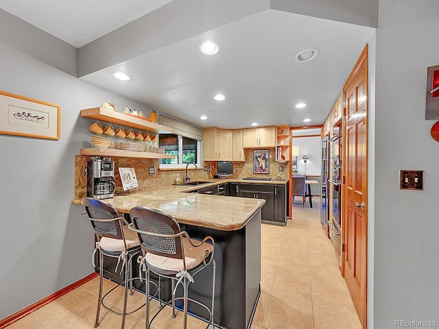 7335 S Milwaukee Way, Centennial, CO 80122 - kitchen featuring open shelves, a peninsula, recessed lighting, tasteful backsplash, and a kitchen bar