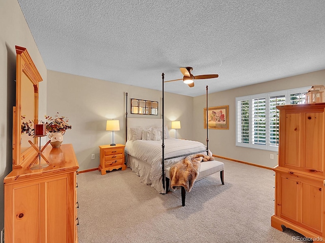 7335 S Milwaukee Way, Centennial, CO 80122 - bedroom featuring light colored carpet, a textured ceiling, and a ceiling fan